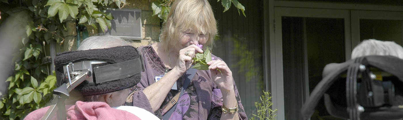 volunteer in garden with patients